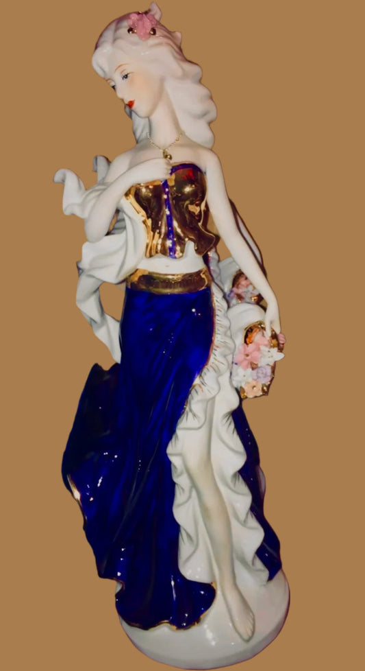 Flower girl in blue in fine porcelain from Spain