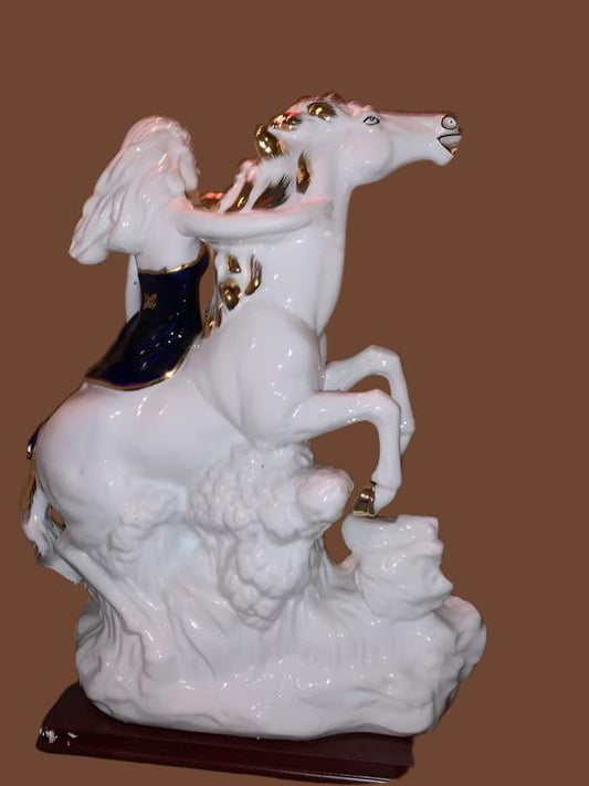 Girl In Blue Ceramic Riding Horse